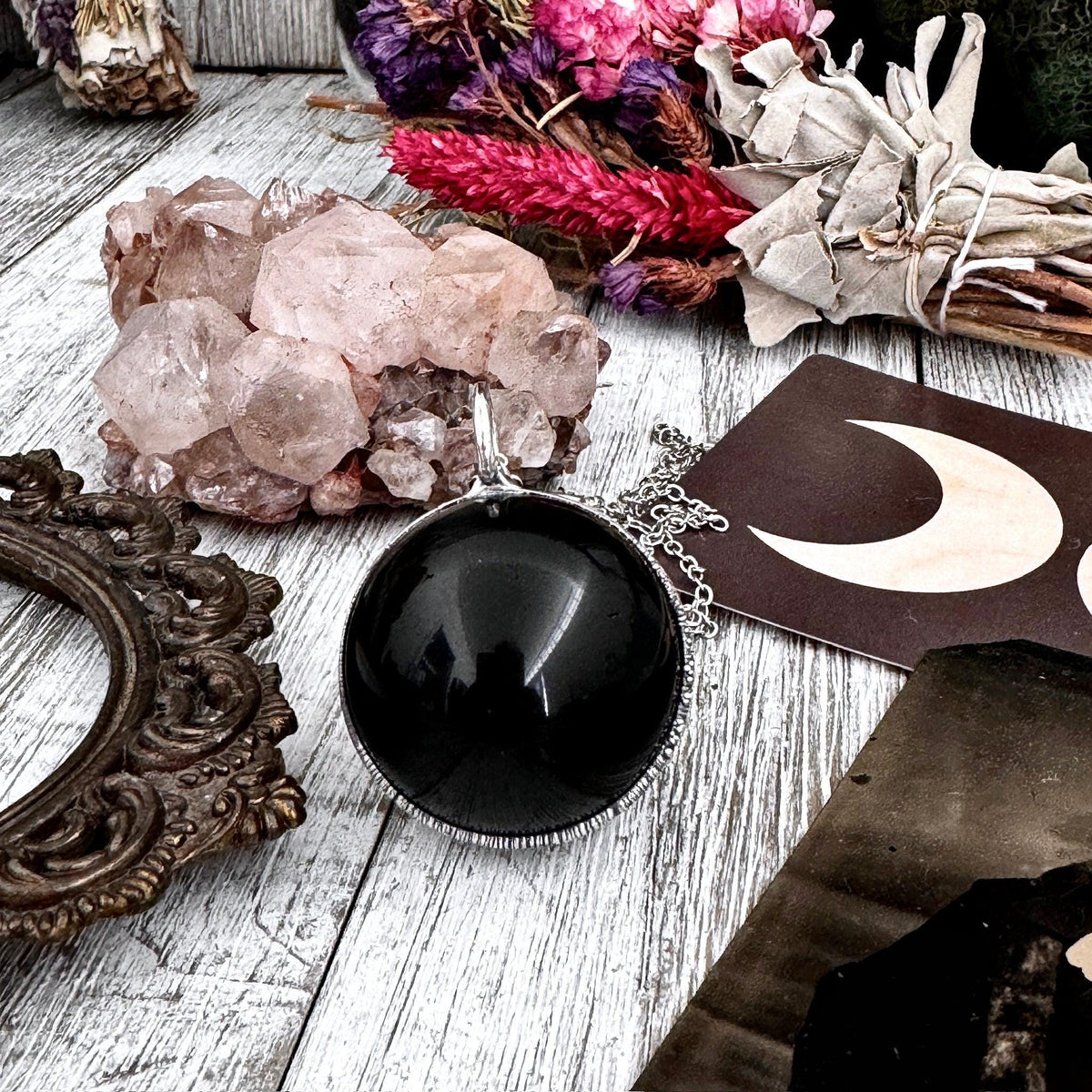 Black Obsidian crystal ball necklace in silver from FOXLARK Collection, featuring a polished obsidian orb on a sleek silver chain.