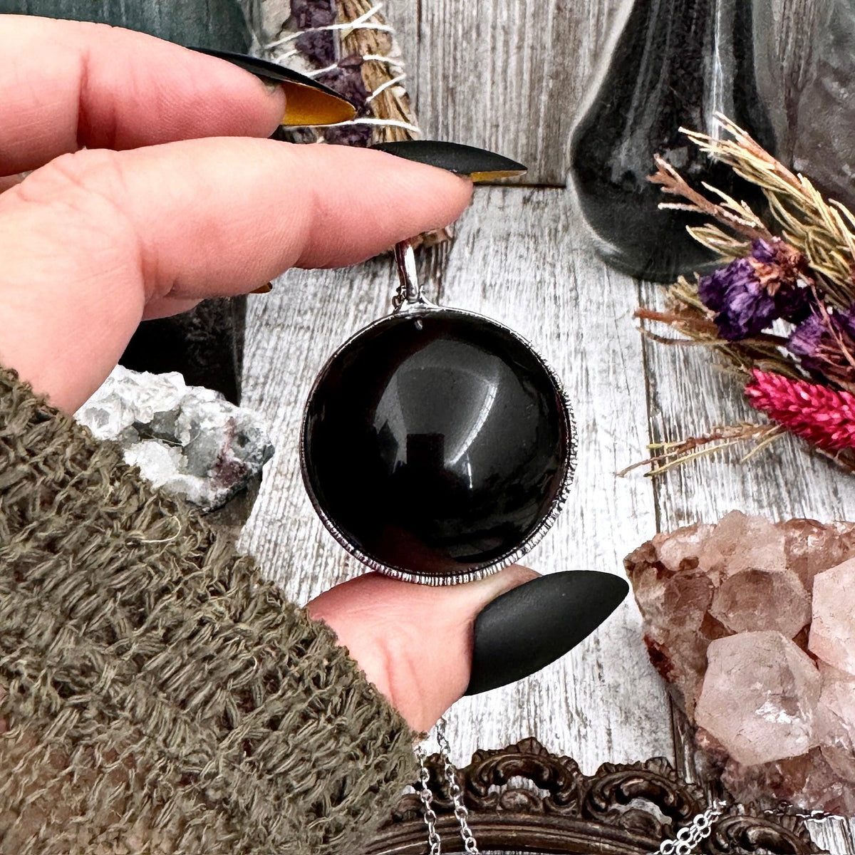 Black obsidian crystal ball necklace in silver from FOXLARK collection, featuring a polished round stone on a delicate chain.