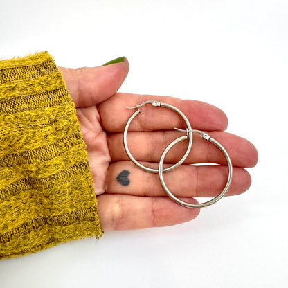 The Everyday Charm Collector Hoop Earrings - Round Tube Stainless Steel Earring Hoops from the Lucky Charm Bar by Foxlark